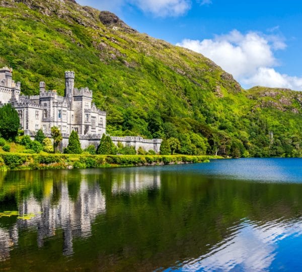 Kylemore Abbey reflected in lake, Connemara – private tours of Ireland